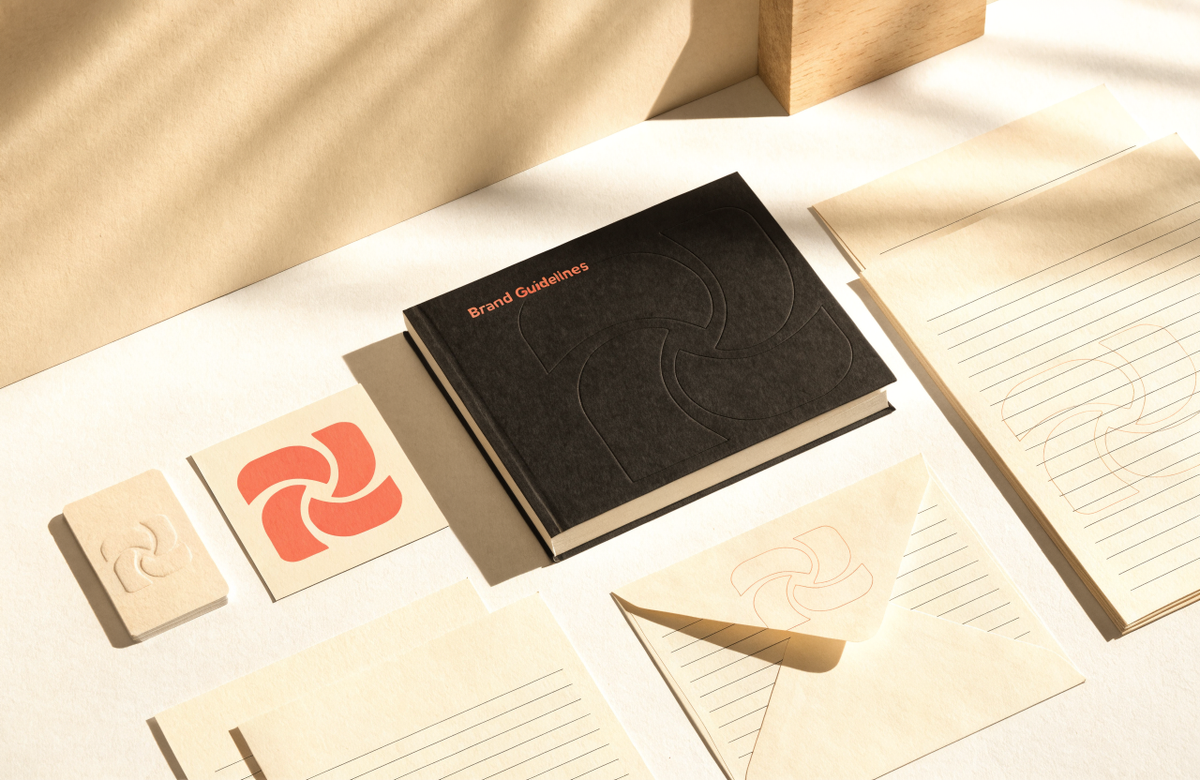 Premium brand identity system with a Brand Guidelines book, stationery and a coral logo, by Clayit. in Dubai