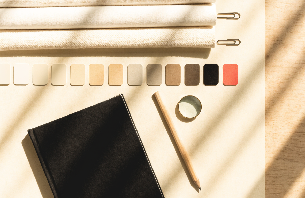 Brand designer's desk with tonal colour swatches, material samples and a portfolio, by Clayit. in Dubai