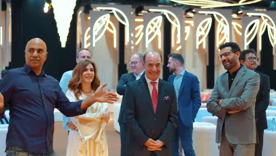Poster frame from the iftar film, guests greeting at the venue